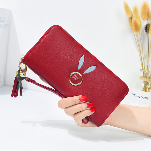 Geanta de dama cu elemente metalice si ciucuri