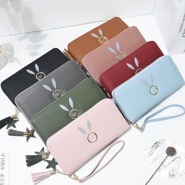 Geanta de dama cu elemente metalice si ciucuri