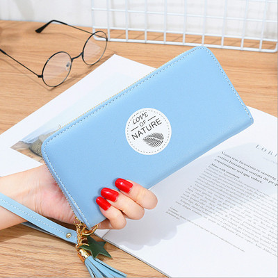 Női pénztárca rátéttel és bojttal