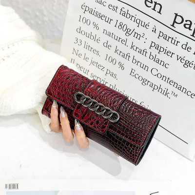 Geanta de dama din piele ecologica reliefata cu element metalic in culorile gri, verde, rosu si negru