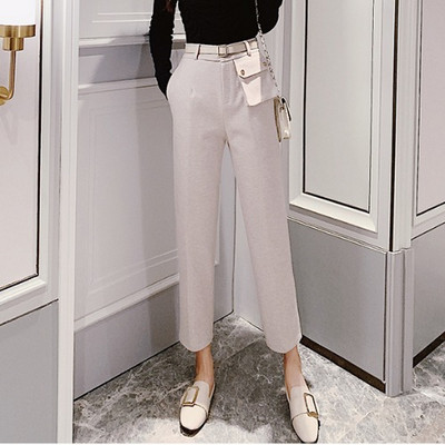 Modern női nadrág magas derékkal és övvel