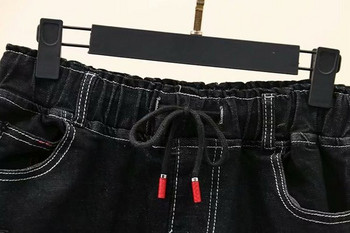 Μοντέρνα γυναικεία φούστα denim  με τσέπη σε μαύρο χρώμα