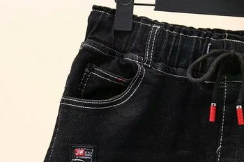 Μοντέρνα γυναικεία φούστα denim  με τσέπη σε μαύρο χρώμα