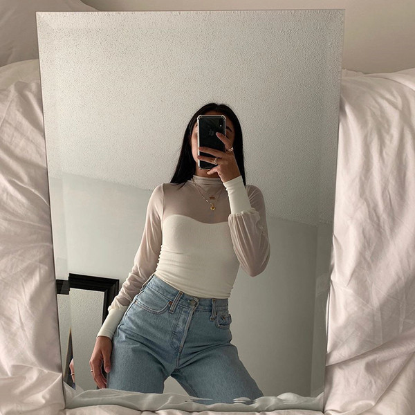 Női alkalmi fehér blúz pólógallérral és hosszú ujjal