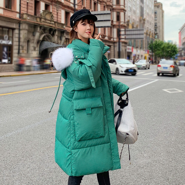 Hosszú női téli kabát zsebekkel, négy színben