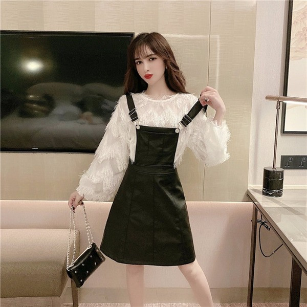 Γυναικεία  σύγχρονη φαρδιά μπλούζα με κρόσσια σε δύο χρώματα