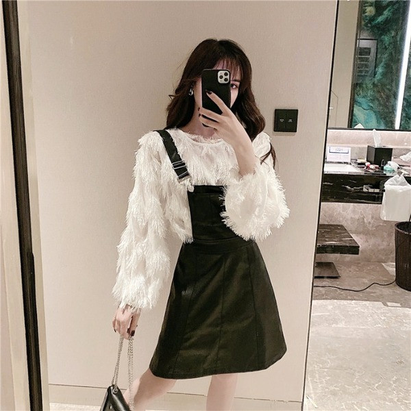 Γυναικεία  σύγχρονη φαρδιά μπλούζα με κρόσσια σε δύο χρώματα