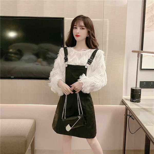 Γυναικεία  σύγχρονη φαρδιά μπλούζα με κρόσσια σε δύο χρώματα