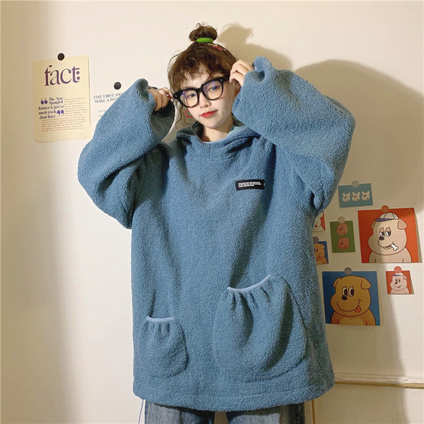 Γυναικείο  χνουδωτό φούτερ με τσέπες και κουκούλα σε δύο χρώματα