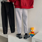 Pantaloni sport de damă, de culoare gri și negru, cu fermoar