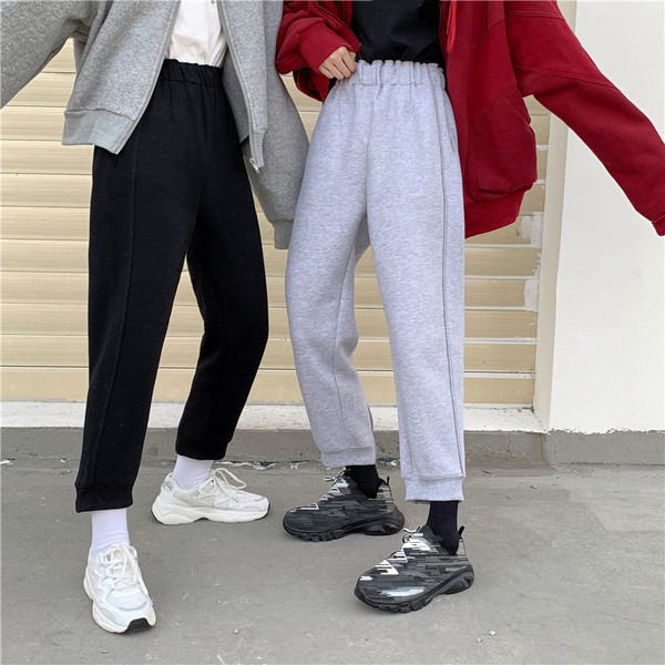 Pantaloni sport de damă, de culoare gri și negru, cu fermoar