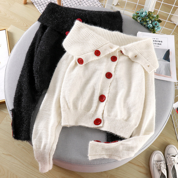 Női alkalmi mellény fekete-fehér színben, gombokkal