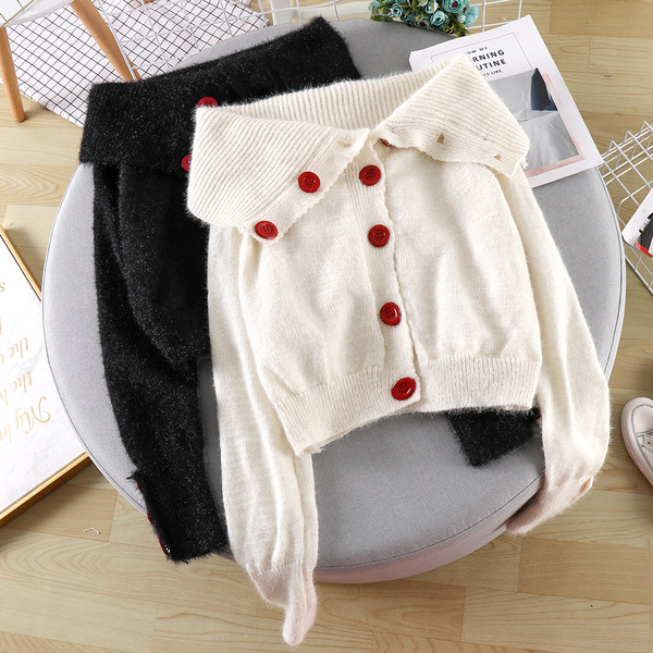 Női alkalmi mellény fekete-fehér színben, gombokkal