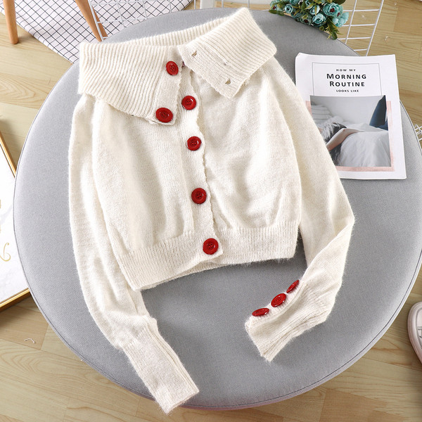 Női alkalmi mellény fekete-fehér színben, gombokkal