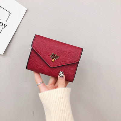 Γυναικείο πορτοφόλι γυναικείο με μεταλλικό στοιχείο σε μαύρο, ροζ, κόκκινο και ασημί χρώμα