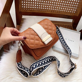 Μοντέρνα γυναικεία τσάντα με μεταλλική πρόσδεση και μεγάλη λαβή