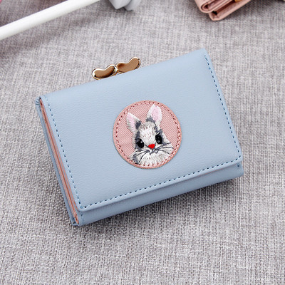 Γυναικείο πορτοφόλι με κέντημα και μεταλλικό κούμπωμα