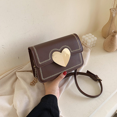 Geanta de dama moderna cu element metalic in patru culori