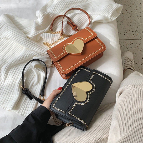 Geanta de dama moderna cu element metalic in patru culori