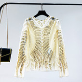 Μια κομψή γυναικεία μπλούζα με πούλιες και ένα μακρύ μανίκι σε δύο χρώματα