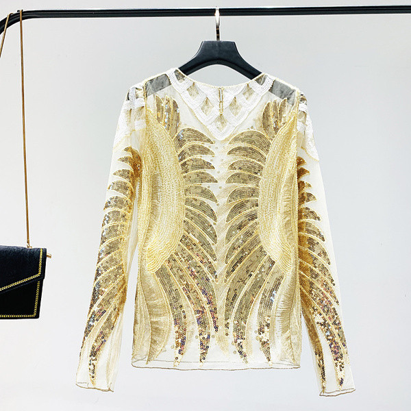 Μια κομψή γυναικεία μπλούζα με πούλιες και ένα μακρύ μανίκι σε δύο χρώματα