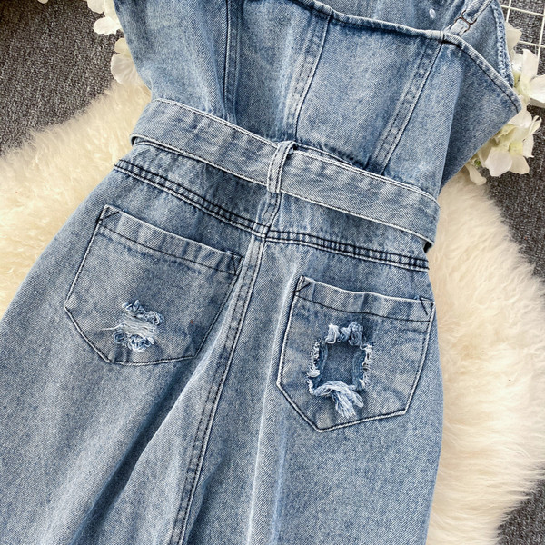 Γυναικείες ολόσωμες φόρμες  τζιν με σκισμένο μοτίβο σε μπλε χρώμα