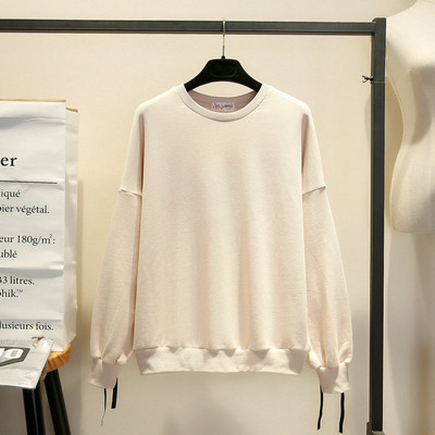 Modern női blúz ovális nyakkivágással és megkötős fehér és fekete színben