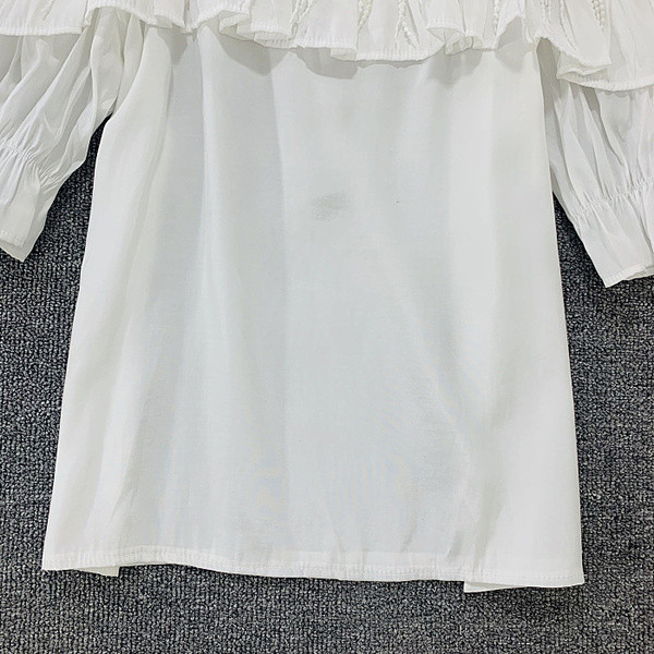 Bluză de damă cu element 3D în negru, alb și galben