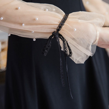 Rochie modernă de damă cu decolteu spitz și perle pe mâneci de culoare neagră