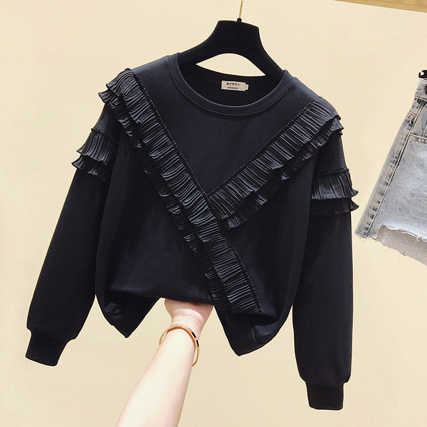 Bluză de damă modernă cu decolteu oval și bucle în alb și negru