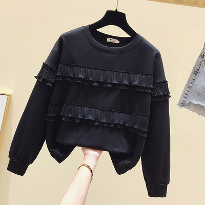 Bluză de damă cu mâneci lungi și decolteu O în alb și negru