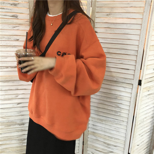 Lezser női blúz kerek nyakkivágással fehér és narancs színben