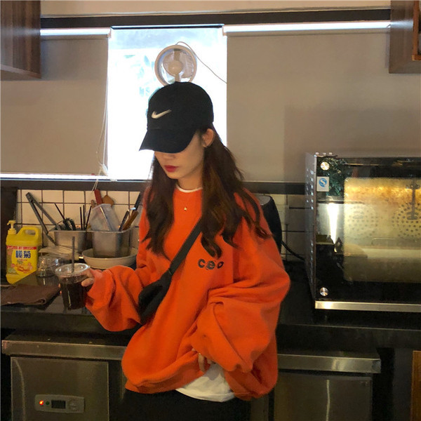 Lezser női blúz kerek nyakkivágással fehér és narancs színben