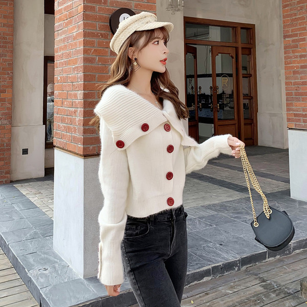 Vesta de dama la moda cu guler polo inalt in alb si negru