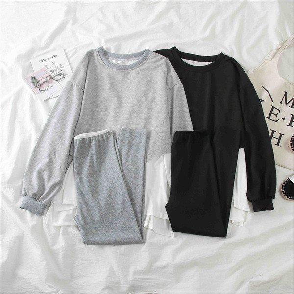 Női sport szett szürke és fekete blúzból és leggingsből