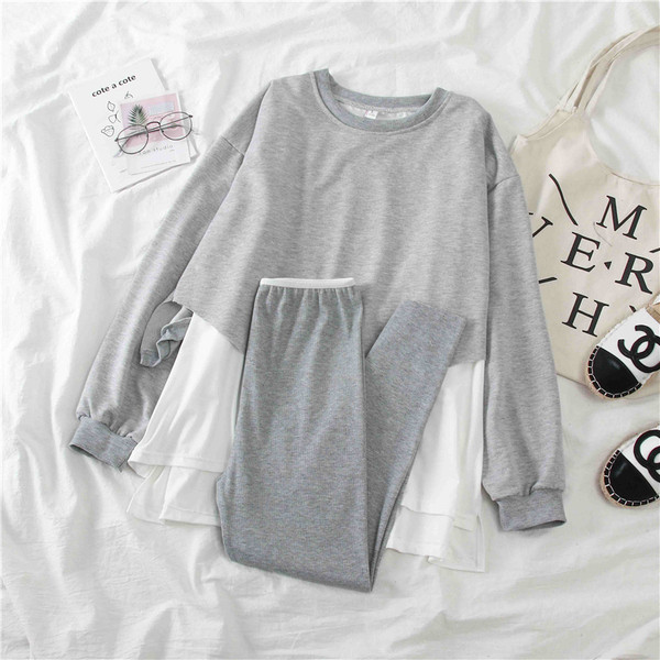 Női sport szett szürke és fekete blúzból és leggingsből