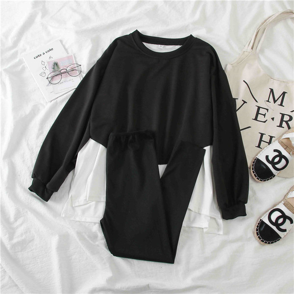 Női sport szett szürke és fekete blúzból és leggingsből