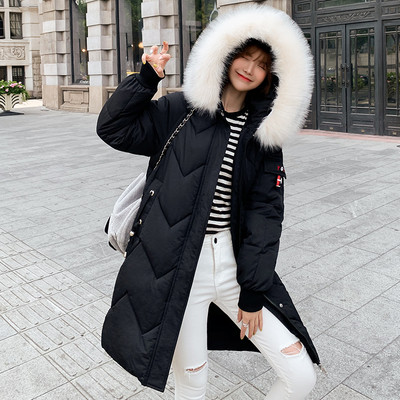 Γυναικείο μακρύ χειμερνό  μπουφάν  με τσέπες και κουκούλα