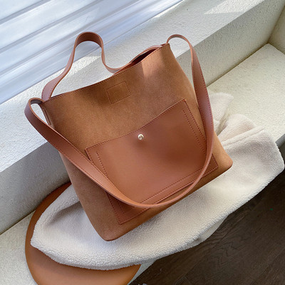 Μοντέρνα γυναικεία τσάντα με μακριά λαβή σε διάφορα χρώματα