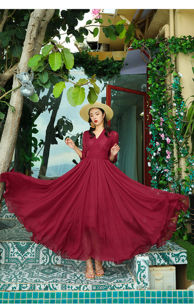 Elegáns női hosszú ruha mély nyakkivágással és 3/4-es ujjakkal, három színben