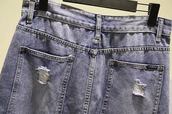 Μοντέρνα γυναικεία φούστα denim με χαραγμένα μοτίβα και τσέπες σε μπλε χρώμα