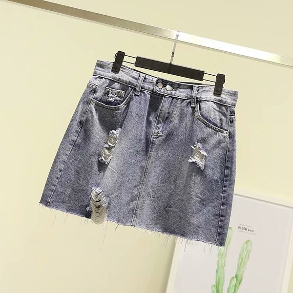 Fusta de dama moderna din denim cu motive rupte si buzunare in albastru