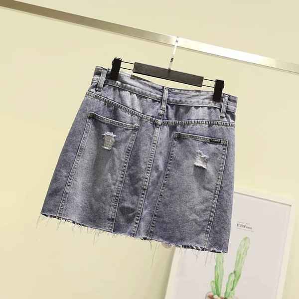 Fusta de dama moderna din denim cu motive rupte si buzunare in albastru