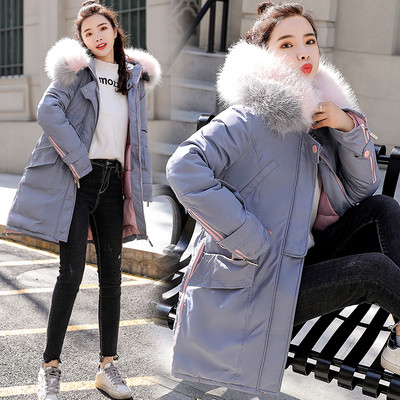 Női téli kabát aszimmetrikus modell és színes pehely