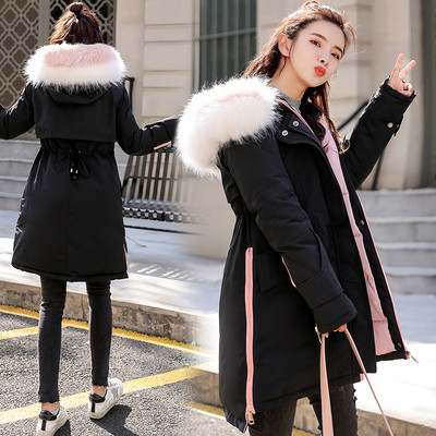 Női téli kabát aszimmetrikus modell és színes pehely