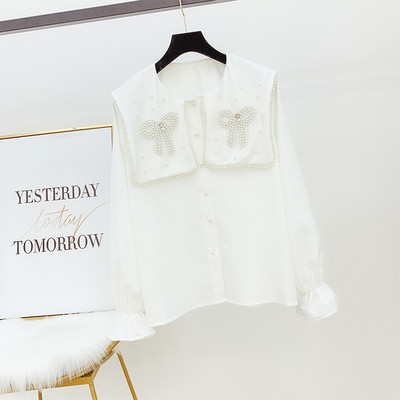 Modern női ing gyöngyökkel, fehér színben