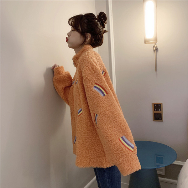 Narancssárga színű puha női pulóver, széles cipzáras modellel