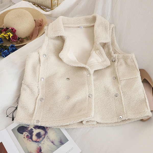 Fém elemekkel ellátott női mellény három színben