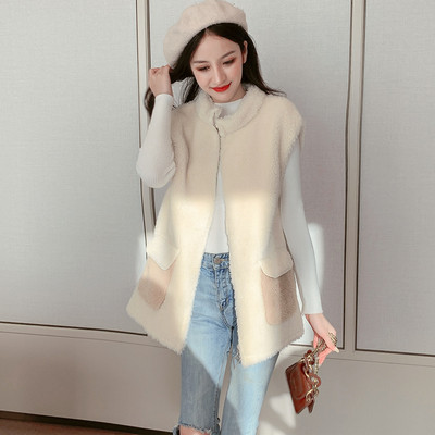 Női mellény új modellje fehér és sárga zsebekkel