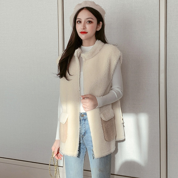 Női mellény új modellje fehér és sárga zsebekkel